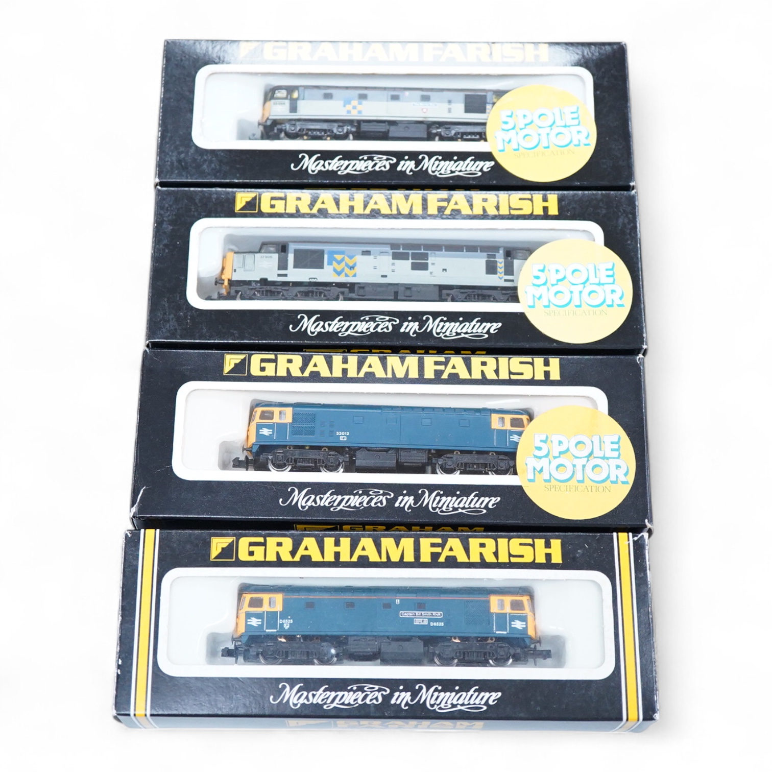 Four boxed Graham Farish N gauge railway diesel locomotives; a BR class 33, D6525 (FA83111), a BR class 33, 33012 (8315), a BR class 33, 33 056 (8316) and a BR class 37, 37 906 (8038).